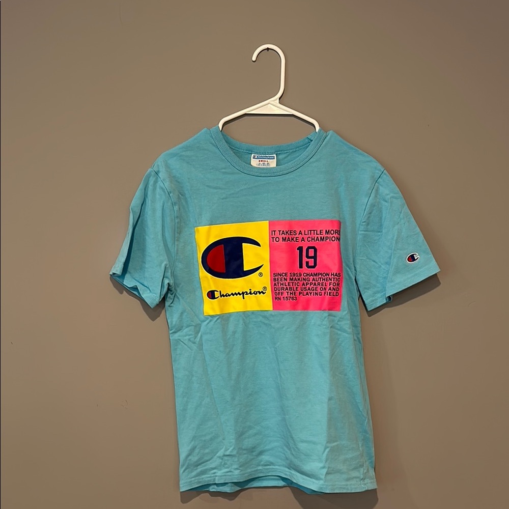 Champion Short Sleeve Light Blue Tee with Neon Graphics & Iconic Logo